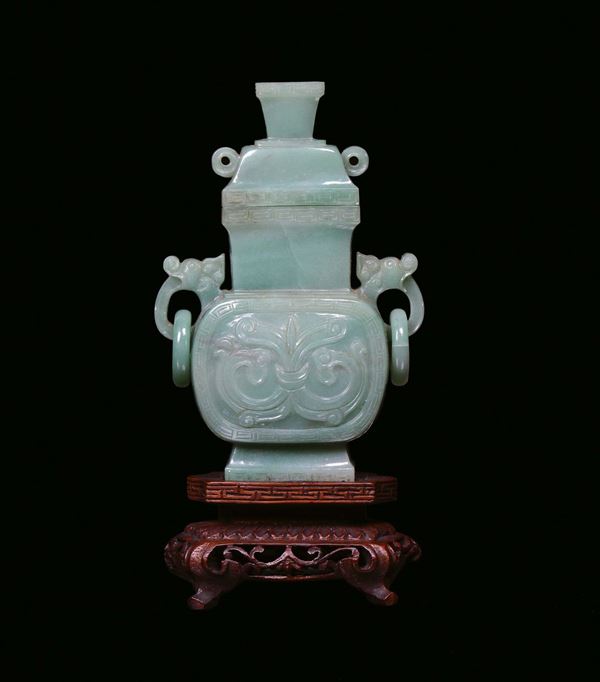 A green jade sculpted capped vase, China, Qing Dynasty, 20th century