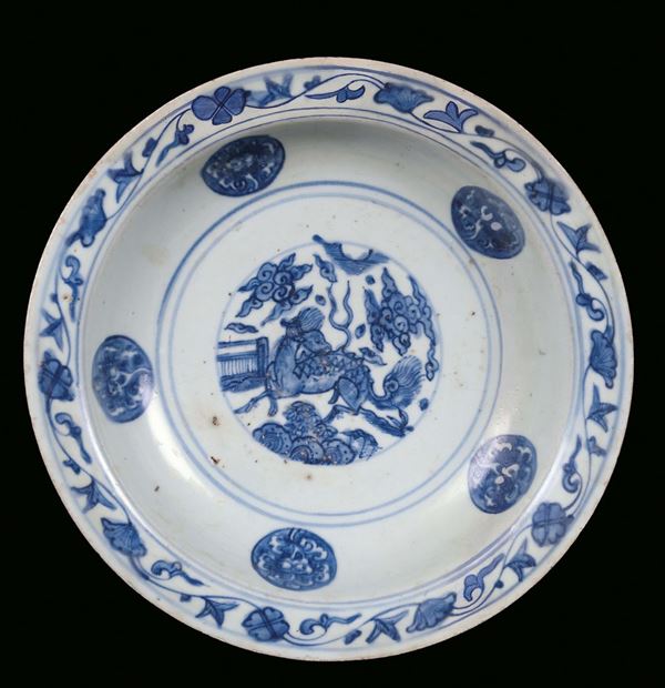 A porcelain plate decorated with azure monochrome with imaginary animal in the centre, China Ming Dynasty, 16th century