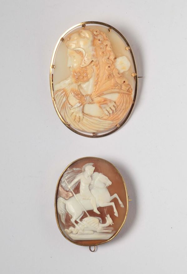 A 19th century two shell cameos. Hercules with lion's skin and Saint George and the Dragon gold mount