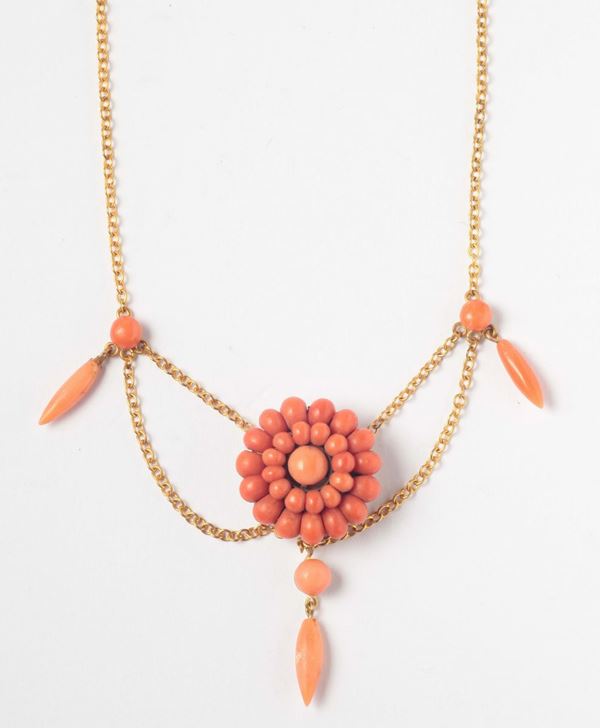 A coral necklace, gold clasp