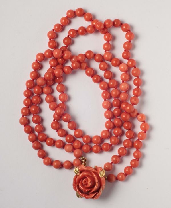 A two coral rows with rose coral carving clasp. Gold mount