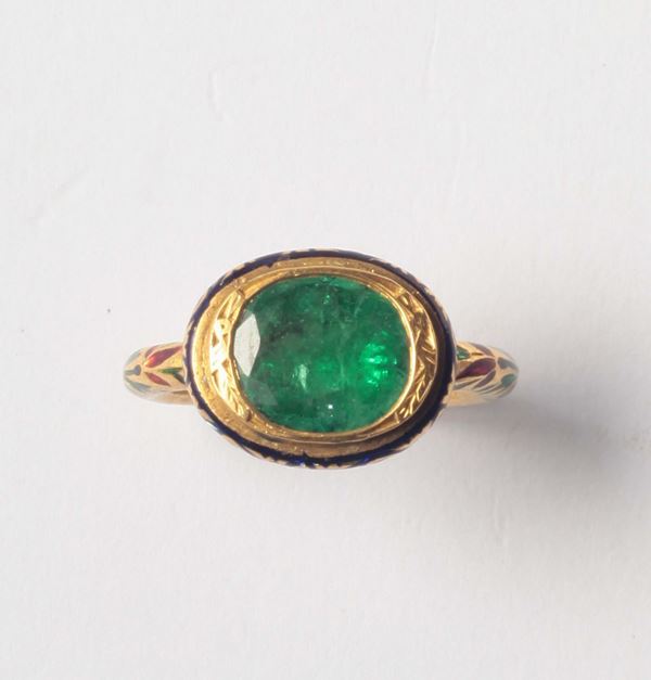 A 20th century emerald ring. Gold and enamel mount. Rajasthan