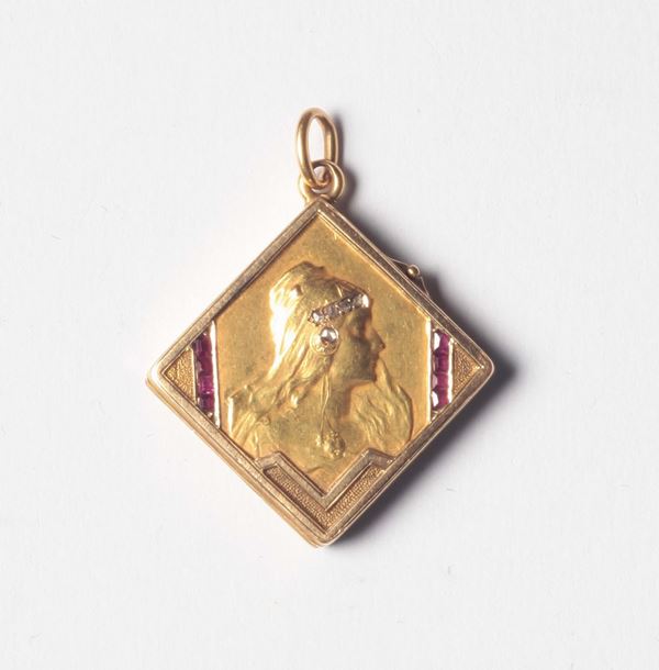 An Art Nouveau gold, diamond and ruby pendant