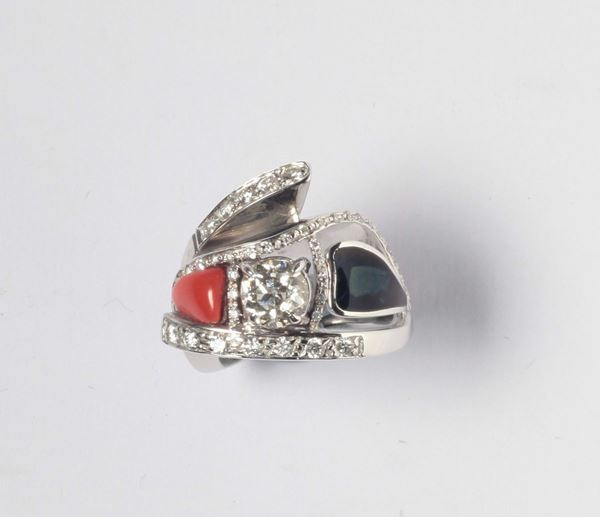 A diamond, enamel and coral ring