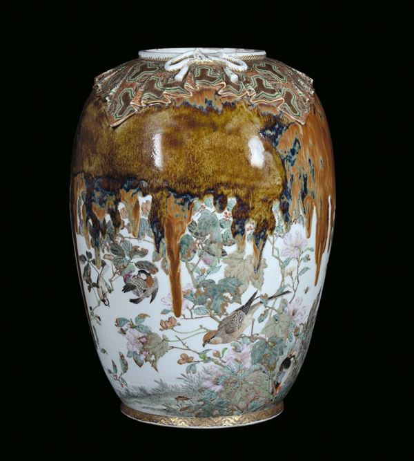 A porcelain vase with decoration and birds on blooming branches, Japan, 19th century