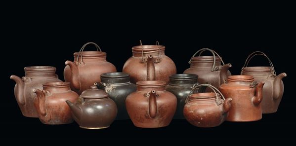A lot of twelve stoneware Yixing teapots of various colours and measures, China, Qing Dynasty, 19th century