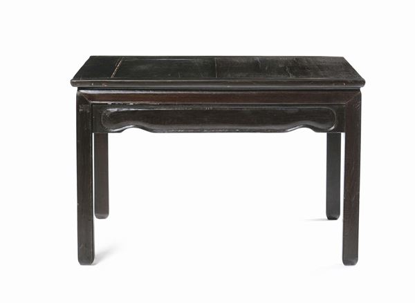 A Homu wood table, China, Qing Dynasty, 19th century. With inscriptions on the legs