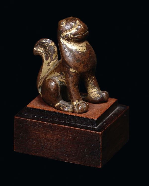 A bronze Pho dog with traces of cold gold plating, China, Wei Dynasty (5th century)