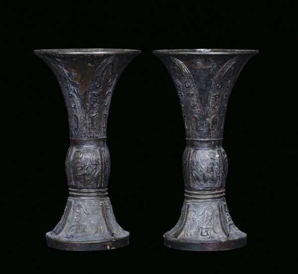 A pair of bronze vases, archaic shape