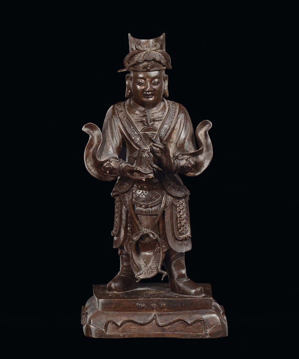 A bronze figure of standing Guandi with teapot, China, Ming Dynasty, 17th century