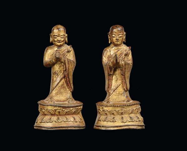 A pair of gilt bronze Lohan figures, China, Ming Dynasty, 16th century