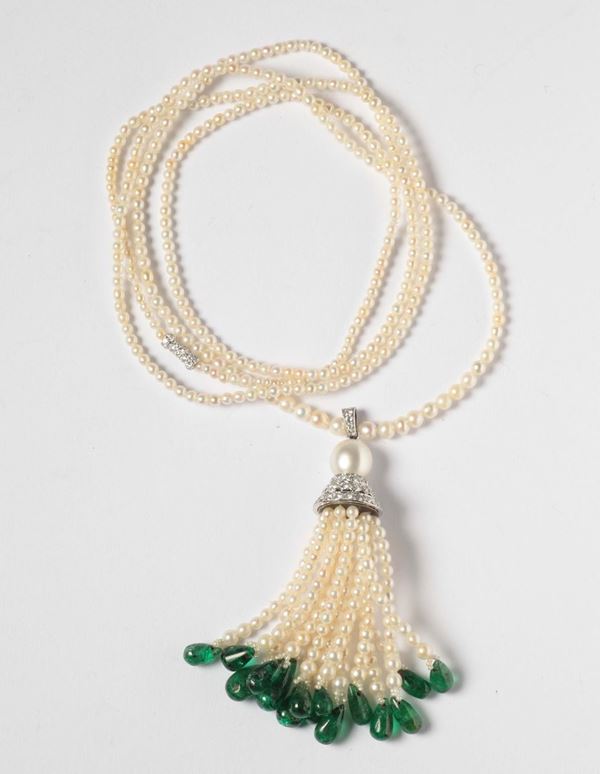 An emerald, pearl and diamond sautoir. 1910 circa