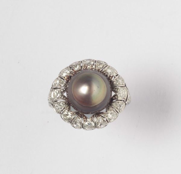 A cultured pearl and diamond ring