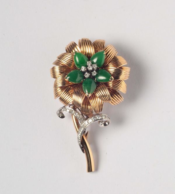 A gold and diamond flower brooch. Signed Tiffany