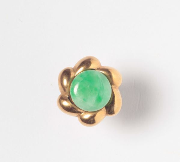A jade and gold ring. 1940 circa