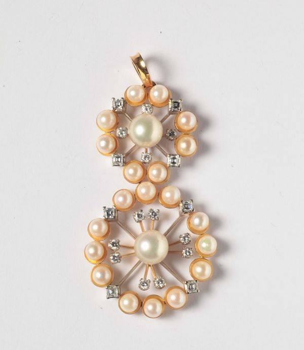 A cultured pearl and diamond pendant