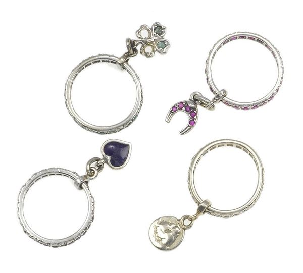Four gem-set porte bonheur rings