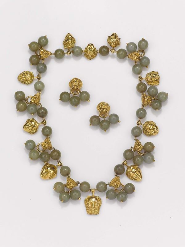 A jade and gold necklace and earrings. 1960 circa