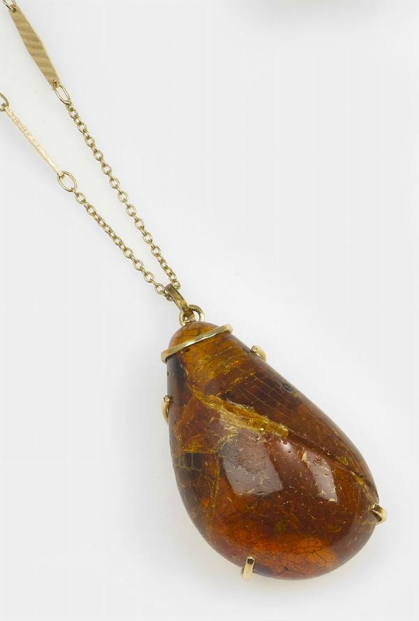 Amber and gold pendant
