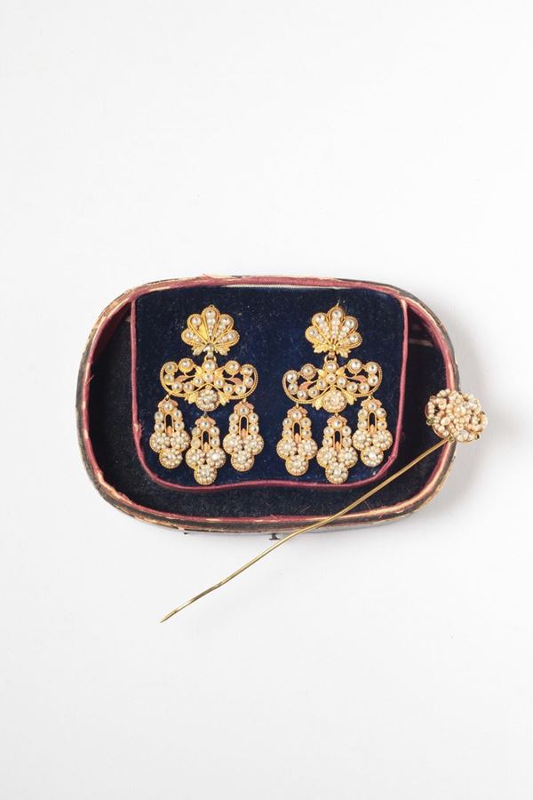 A 17th century pair of seed pearls and gold earrings