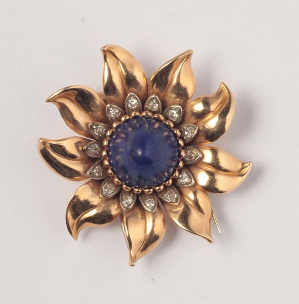 A flower and gold lapis lazuli brooch. 1940 circa