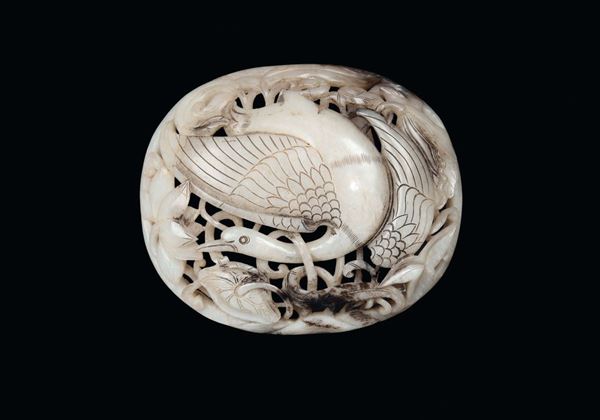 A rare white fretworked jade with vegetable motives and a duck, China, Yuan Dynasty (1279-1368)