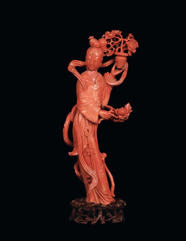A red coral group representing Guanyin with vase and flowers, China, beginning 20th century