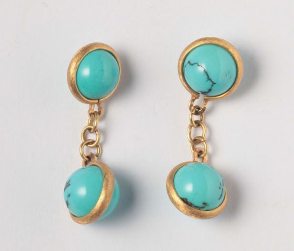 A pair of turquoise cufflinks