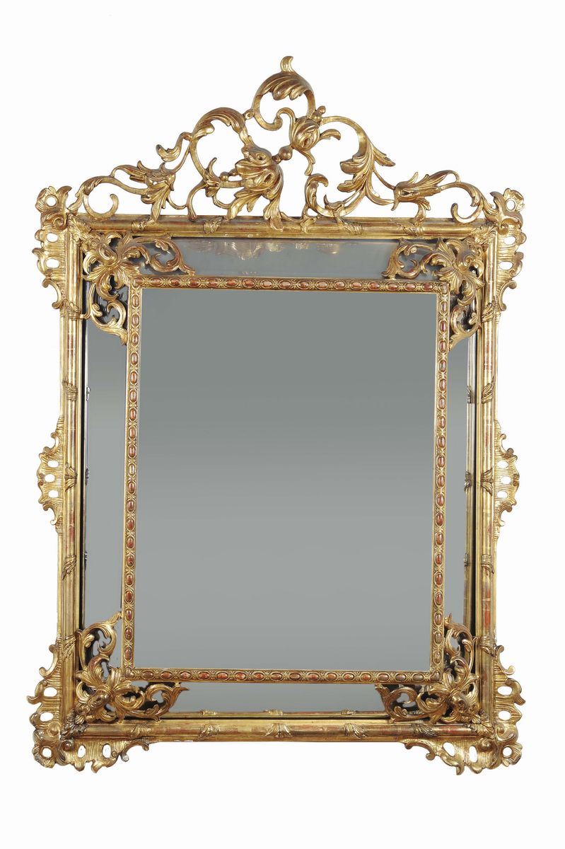 Specchiera in legno intagliato e dorato, XX secolo  - Auction Furnishings from the mansions of the Ercole Marelli heirs and other property - Cambi Casa d'Aste