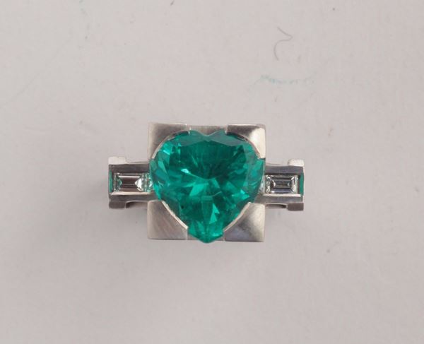 Tower. A heart-cut emerald and  4 baguette diamonds ring. By Enrico Cirio, Italy 2003. Accompanied by R.A.G. Turin Italy