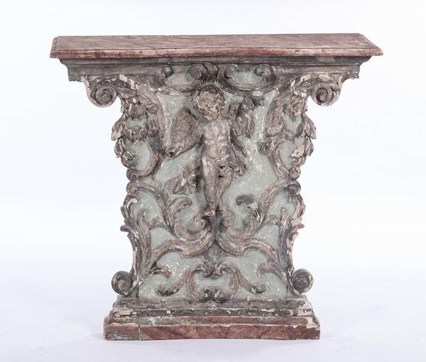 Consolina in legno con fronte intagliato con putto, XVIII secolo