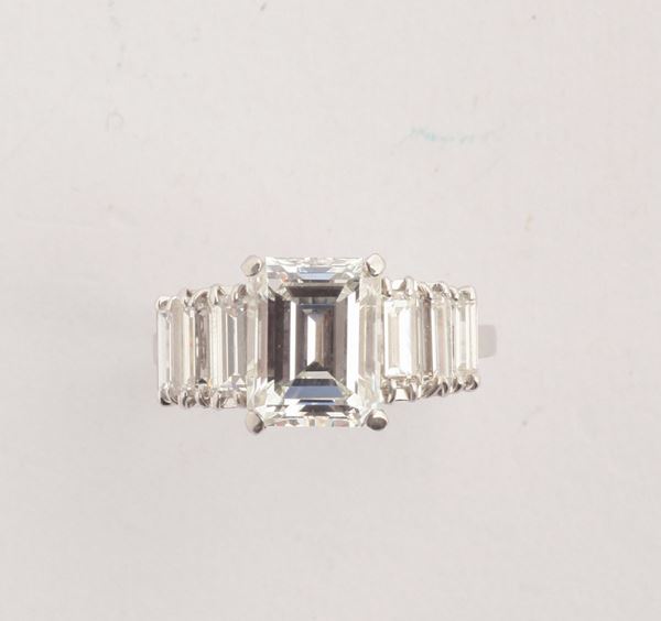 A diamond and platinum ring. Emerald-cut diamond weighing ct.3,12 circa