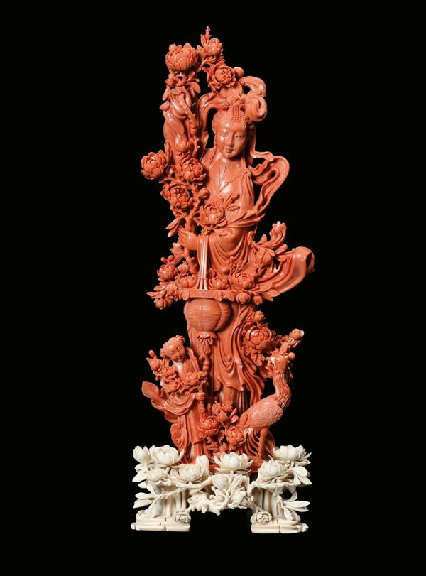 A carved red coral figure of Guanyin and other characters, China, Qing Dynasty, late 19th century