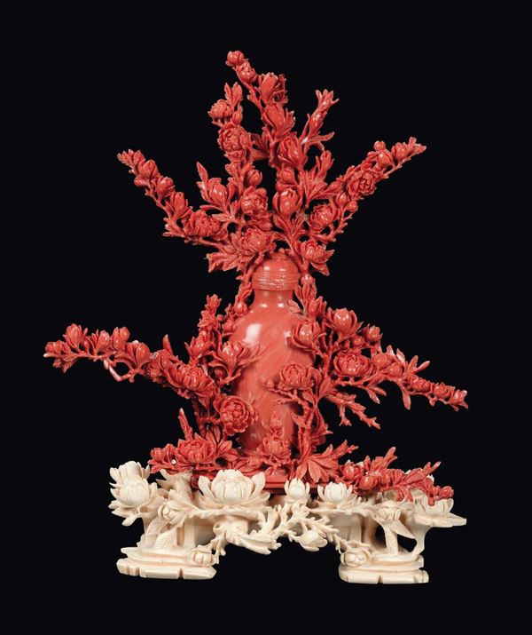 A red coral vase with rich floral decoration, China, Qing Dynasty, late 19th century