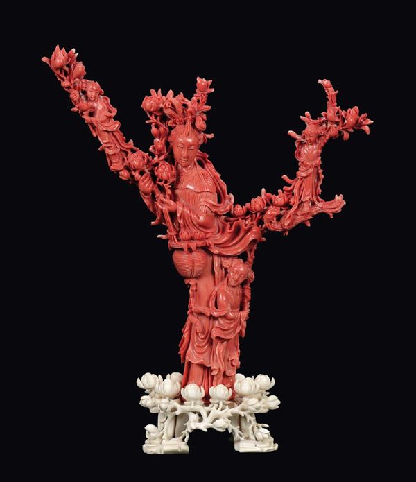 A coral “Guanyin and boys on a branch” group, China, Qing Dynasty, late 19th century