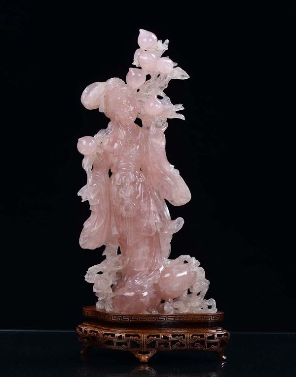 A rose quartz Guanyin figure with flowers, China, 20th century