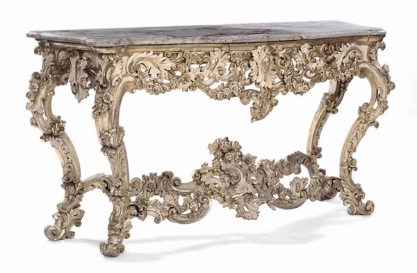 Grande console in legno riccamente intagliato e laccato bianco con lumeggiature in oro, Roma XVIII secolo