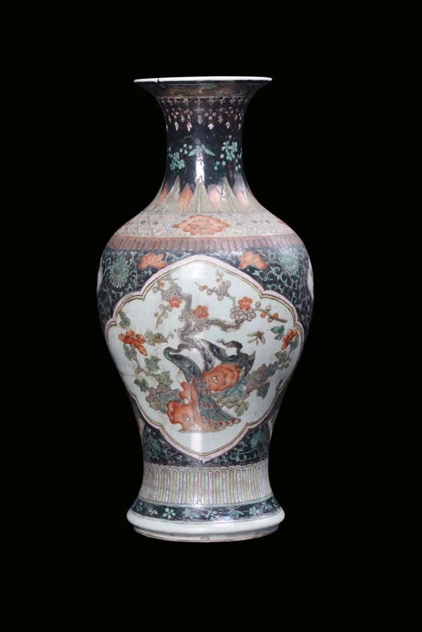 A polychrome Famille-Noire porcelain vase with floral decoration, China, Qing Dynasty, 19th century