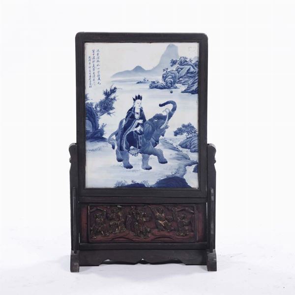 A table screen withe blue and white porcelain plaque with Guanyin on an elephant and inscription, China, early 20th century