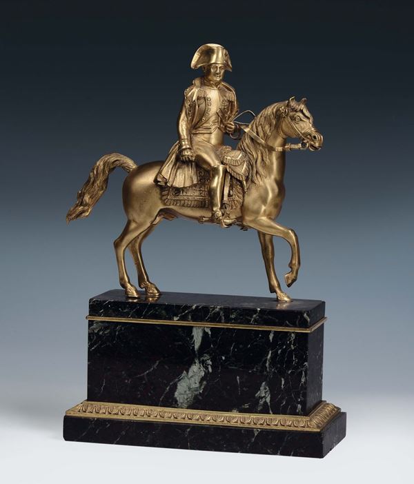 A gilt bronze riding Napoleon, French art of the 19th century, marble base with frames with small gilt bronze palms