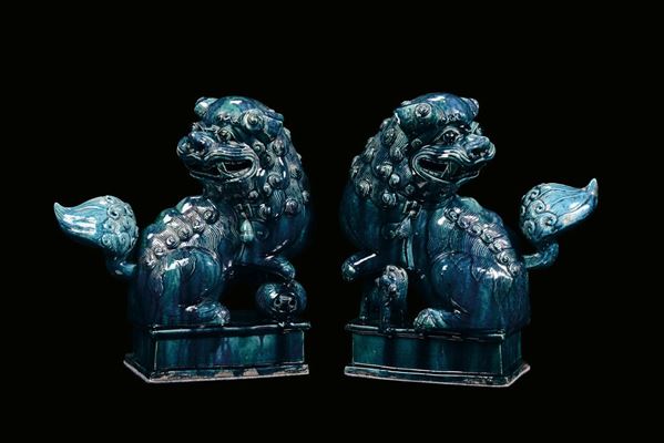 A pair of turquoise enameled ceramic “Phi dog” sculpture, China, Qing Dynasty, 19th century