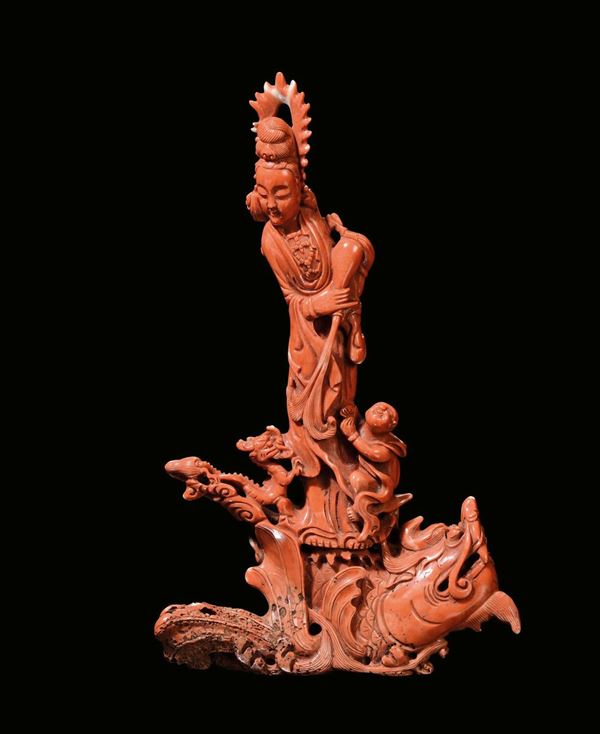 A coral Guanyin with boy, China, Qing Dynasty, late 19th century