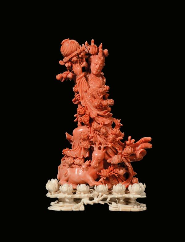 A coral figure of Guanyin on ivory base, China, Qing Dynasty, late 19th century