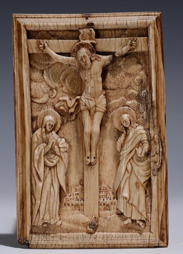 A carved ivory plate representing the Crucifixion, transalpine sculptor, 19th - 20th century