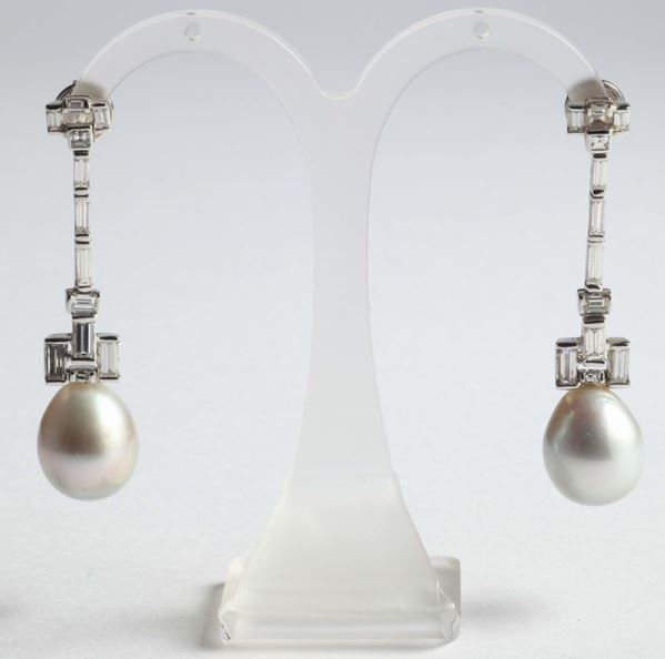 A pair of cultured pearls and diamond pendent earrings