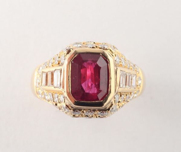 A ruby and diamonds ring. Ruby weighing ct.2,40, with no indication of heating (NTE). Accompanied by I.G.I. report
