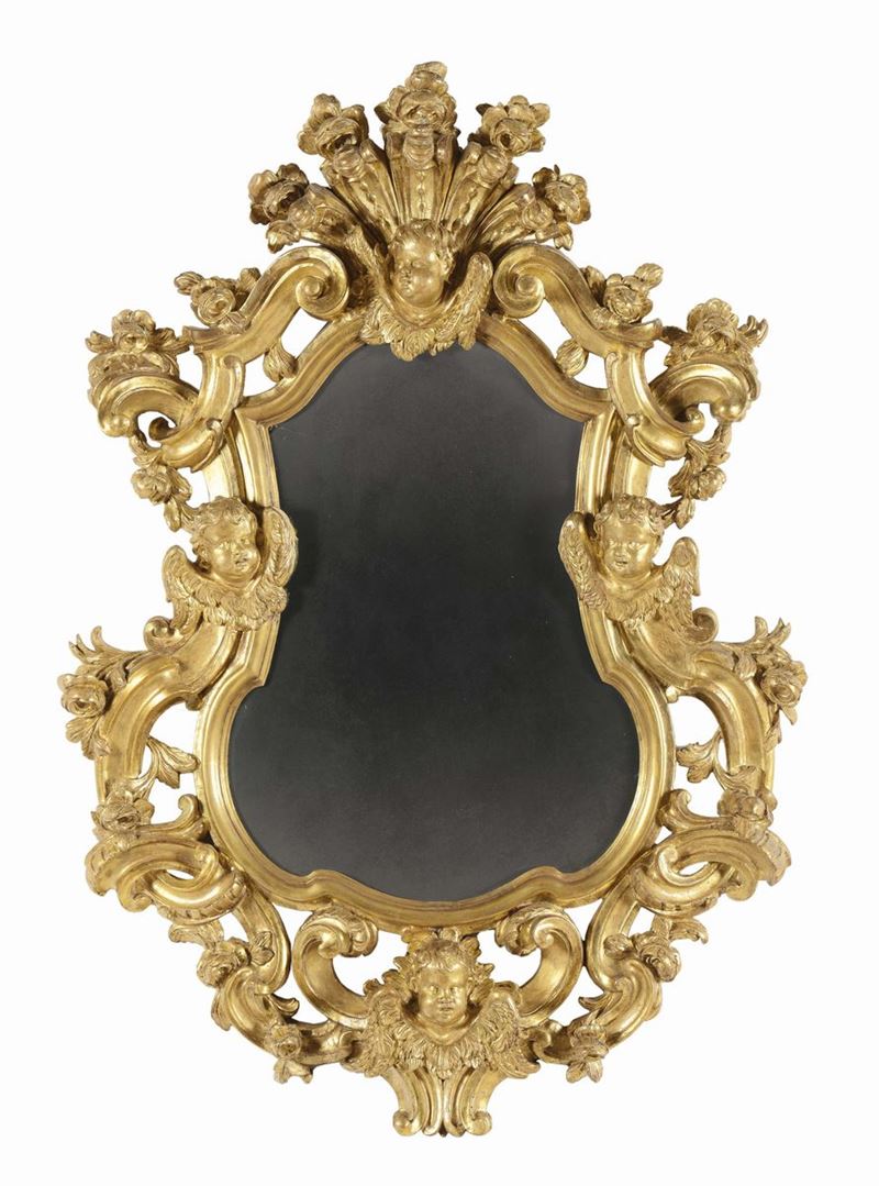 Specchiera in legno intagliato e dorato dal profilo sagomato, XIX secolo  - Auction Fine Arts from refined private house - Cambi Casa d'Aste