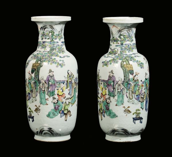 A pair of polychrome porcelain vases decorated with figures, China, Qing Dynasty, 19th century