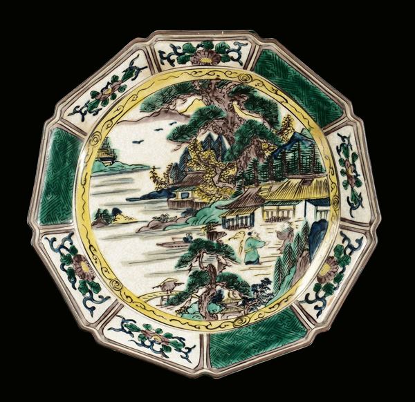 A porcelain dish with polychrome decoration in shades of green depicting landscape, Japan, Genroku, 19th century