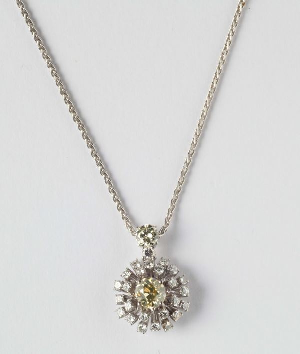 A gold and diamond pendent